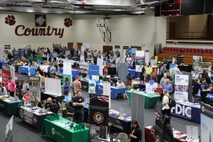 Career Expo in gymnasium for students to network 